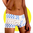 This image displays a pair of men's boxer trunks, featuring a vibrant and playful print of blue and beige mountain-like shapes against a white background. Crafted from a blend of 95% organic cotton and 5% Lycra, these trunks offer both comfort and flexibility, ensuring a superior fit.